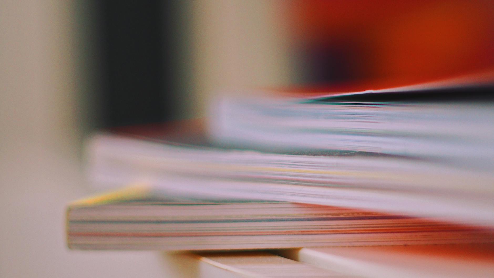 selective focus photo of thick books