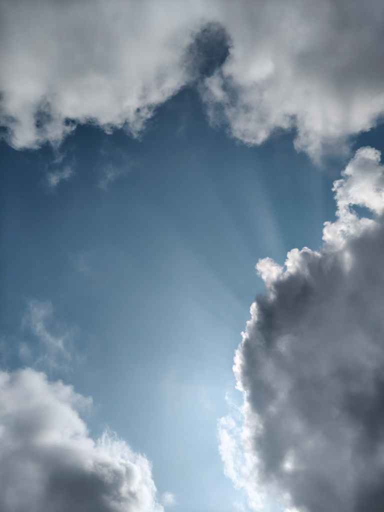 dramatic sky with sun rays and clouds